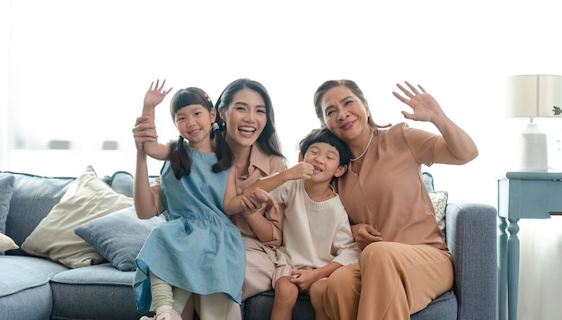 Free photo asian family happy taking photo together in the living room