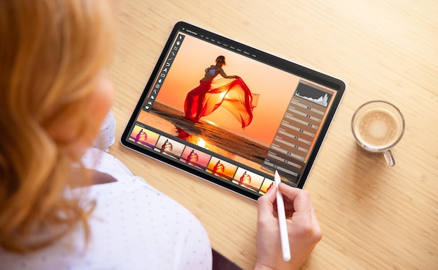 Photo woman using stylus pen for image editing on tablet computer